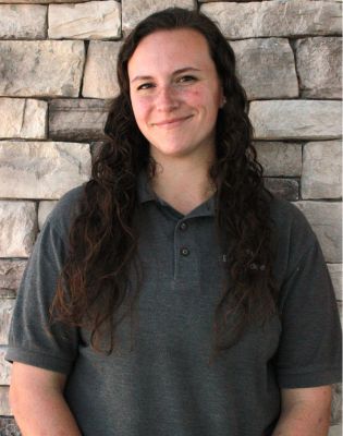 a woman with long hair smiling